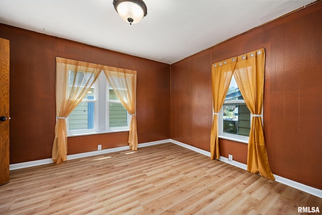 1013 N 2nd St, Pekin, IL 61554 - spare room with wood finished floors and wood walls