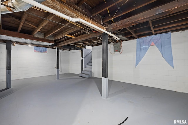 1013 N 2nd St, Pekin, IL 61554 - unfinished below grade area with stairway and concrete block wall