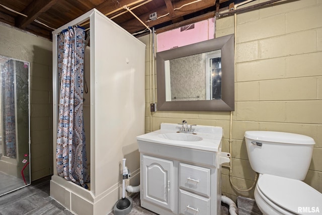 1013 N 2nd St, Pekin, IL 61554 - bathroom with a stall shower, vanity, and concrete block wall