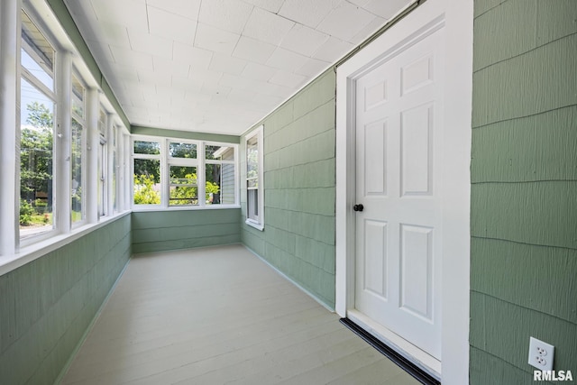 1013 N 2nd St, Pekin, IL 61554 - unfurnished sunroom featuring healthy amount of natural light and wood finished floors
