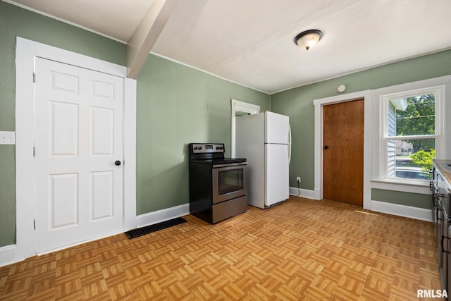 1013 N 2nd St, Pekin, IL 61554 - kitchen featuring electric stove and freestanding refrigerator
