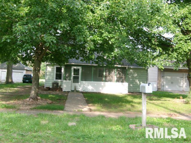 102 N Park Ave, Manito, IL 61546 - view of property hidden behind natural elements with a shingled roof and a garage