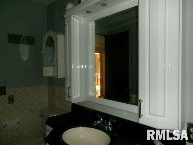 102 N Park Ave, Manito, IL 61546 - bathroom featuring toilet and vanity