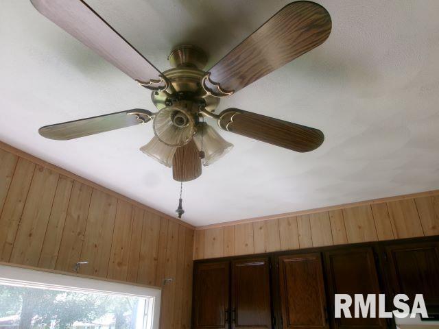 102 N Park Ave, Manito, IL 61546 - detailed view of a ceiling fan and wood walls