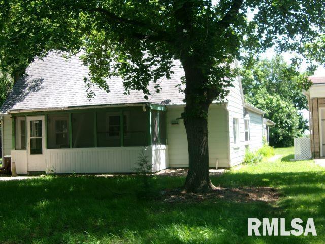 102 N Park Ave, Manito, IL 61546 - rear view of house featuring a sunroom, a lawn, and roof with shingles