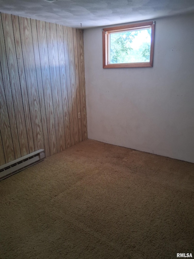 102 N Park Ave, Manito, IL 61546 - carpeted empty room featuring a baseboard heating unit