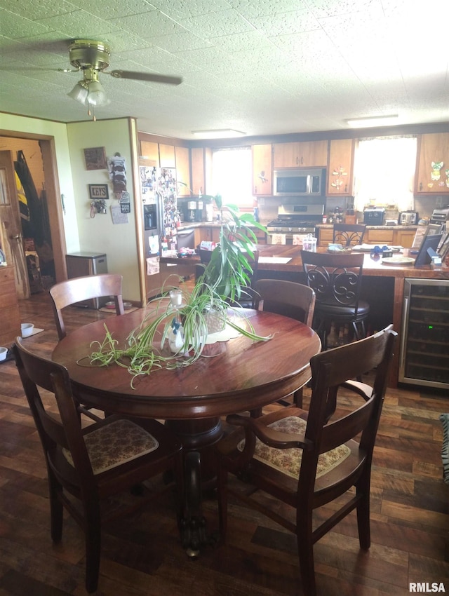 19635 E 800th St, Sciota, IL 61475 - dining area featuring wine cooler, ceiling fan, and wood finished floors