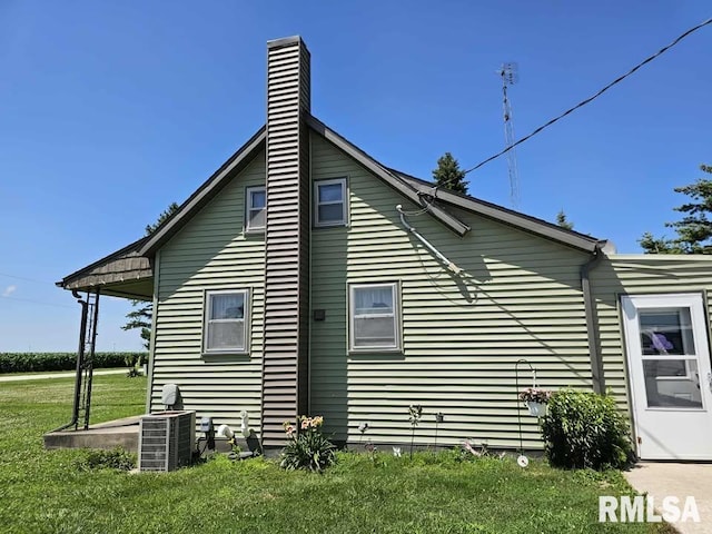 19635 E 800th St, Sciota, IL 61475 - view of home's exterior featuring a lawn and a chimney