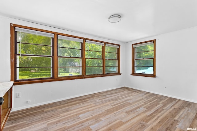 1726 N Pierson Dr, West Peoria, IL 61604 - spare room featuring light wood-style floors and baseboards