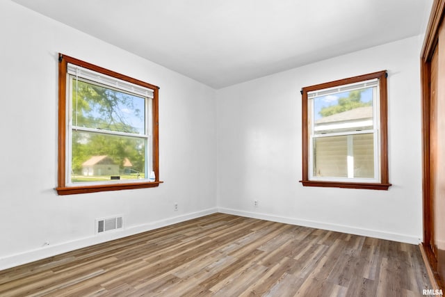 1726 N Pierson Dr, West Peoria, IL 61604 - empty room featuring plenty of natural light and wood finished floors