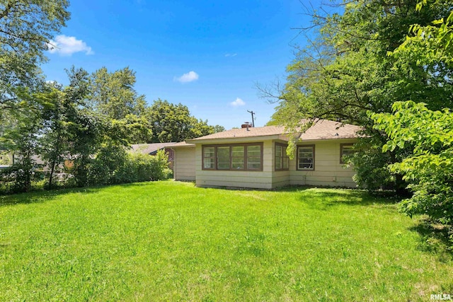 1726 N Pierson Dr, West Peoria, IL 61604 - rear view of property with a lawn