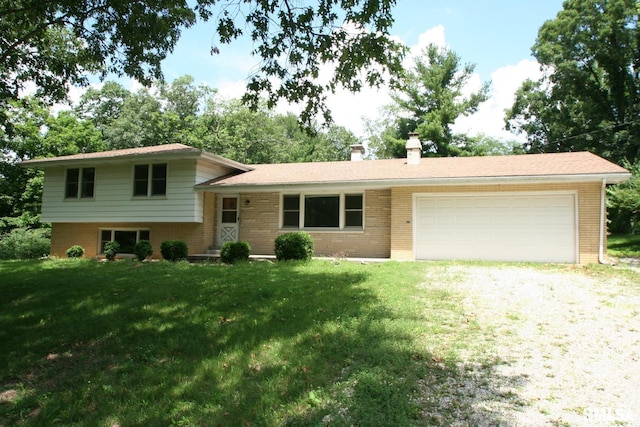 29724 Allentown Rd, Mackinaw, IL 61755 - split level home featuring brick siding, driveway, a chimney, and a garage
