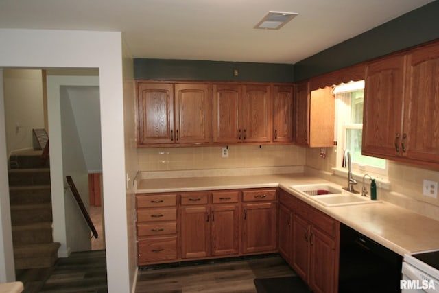 29724 Allentown Rd, Mackinaw, IL 61755 - kitchen featuring dishwasher, backsplash, dark wood-style floors, and brown cabinetry