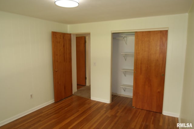 29724 Allentown Rd, Mackinaw, IL 61755 - unfurnished bedroom featuring a closet and wood finished floors