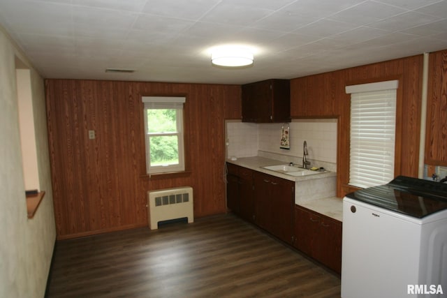 29724 Allentown Rd, Mackinaw, IL 61755 - kitchen featuring radiator, washer / clothes dryer, light countertops, dark wood-type flooring, and wood walls