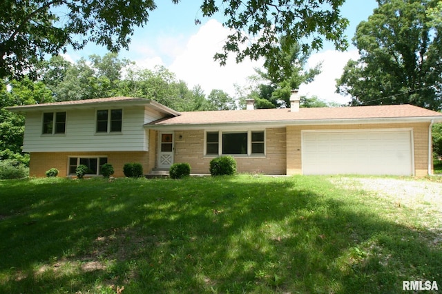 29724 Allentown Rd, Mackinaw, IL 61755 - split level home featuring brick siding, a chimney, a garage, a front lawn, and driveway