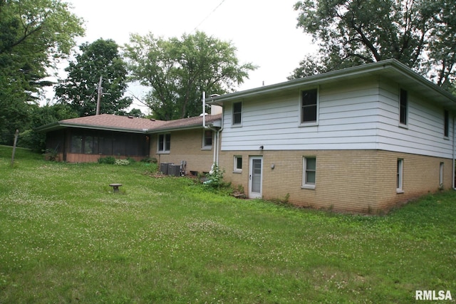 29724 Allentown Rd, Mackinaw, IL 61755 - back of house with brick siding and a yard