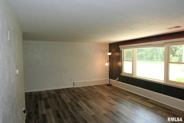 29724 Allentown Rd, Mackinaw, IL 61755 - empty room with dark wood-type flooring and baseboards