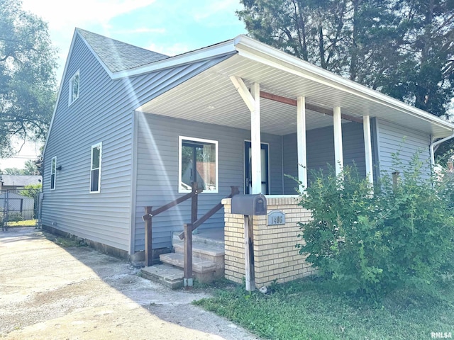 1406 6th St, Pekin, IL 61554 - view of front facade with covered porch and a shingled roof
