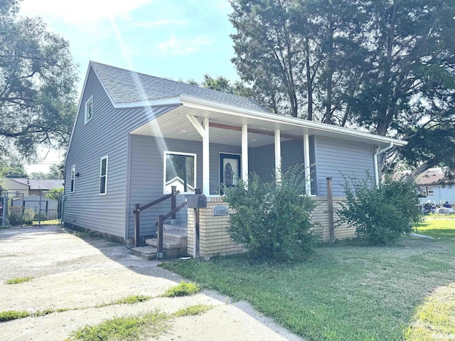 1406 6th St, Pekin, IL 61554 - view of front of house featuring a porch and a shingled roof