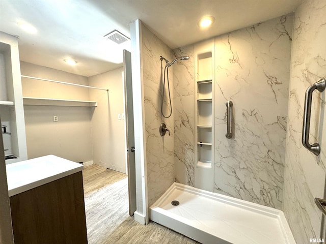 1406 6th St, Pekin, IL 61554 - bathroom featuring a marble finish shower, wood finished floors, vanity, and recessed lighting