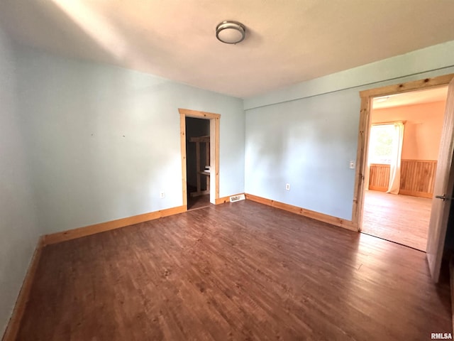1406 6th St, Pekin, IL 61554 - spare room with dark wood-type flooring and baseboards