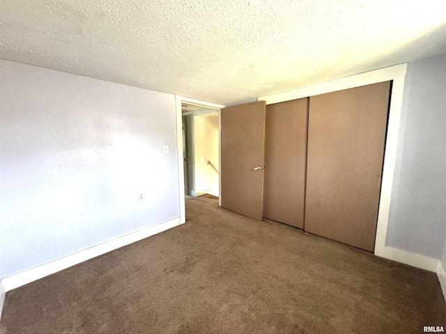 1406 6th St, Pekin, IL 61554 - unfurnished bedroom featuring carpet flooring, a closet, and a textured ceiling