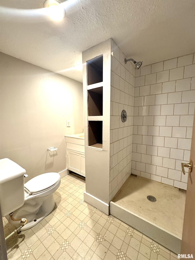 1406 6th St, Pekin, IL 61554 - full bathroom with vanity, a stall shower, a textured ceiling, and tile patterned floors