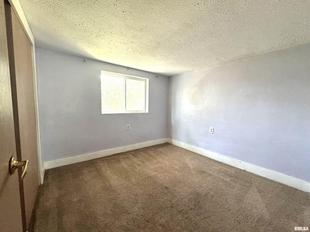 1406 6th St, Pekin, IL 61554 - carpeted empty room featuring a textured ceiling and baseboards