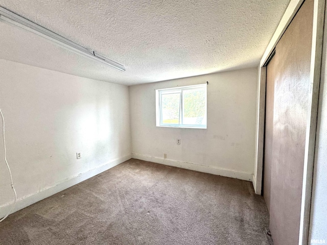 1406 6th St, Pekin, IL 61554 - unfurnished bedroom featuring carpet floors, a closet, and a textured ceiling