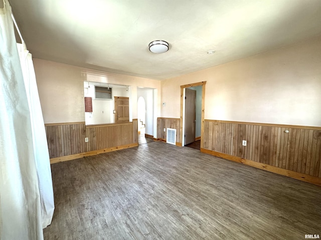 1406 6th St, Pekin, IL 61554 - spare room with wood finished floors, a wainscoted wall, and wooden walls