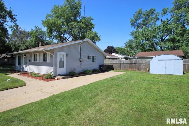 1409 Alton St, Pekin, IL 61554 - view of side of home with a shed and a patio