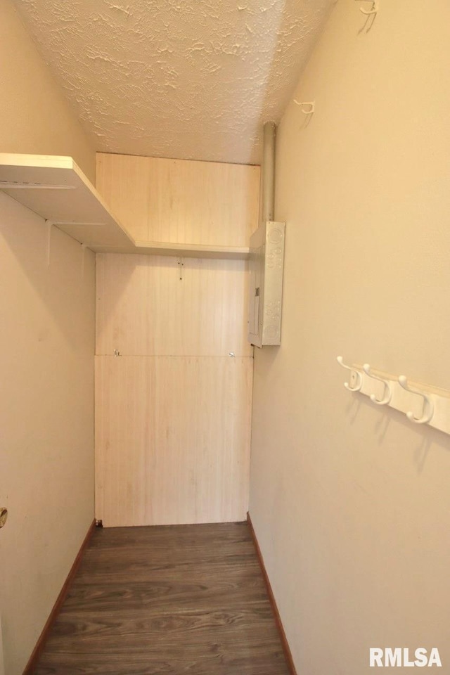 1409 Alton St, Pekin, IL 61554 - walk in closet featuring dark wood-type flooring and electric panel
