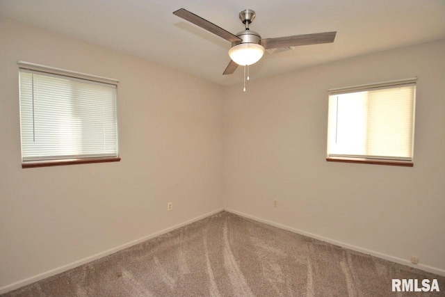 1409 Alton St, Pekin, IL 61554 - carpeted spare room featuring ceiling fan and baseboards