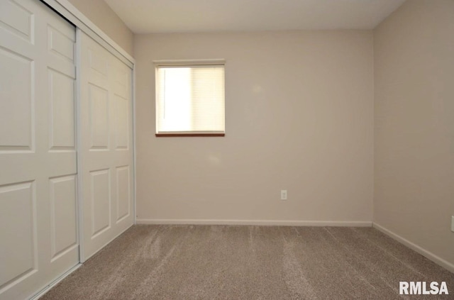 1409 Alton St, Pekin, IL 61554 - unfurnished bedroom featuring carpet and a closet