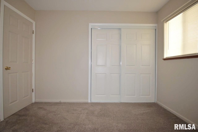 1409 Alton St, Pekin, IL 61554 - unfurnished bedroom with carpet and a closet