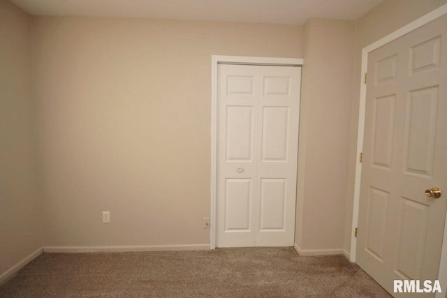 1409 Alton St, Pekin, IL 61554 - unfurnished bedroom featuring carpet flooring and a closet
