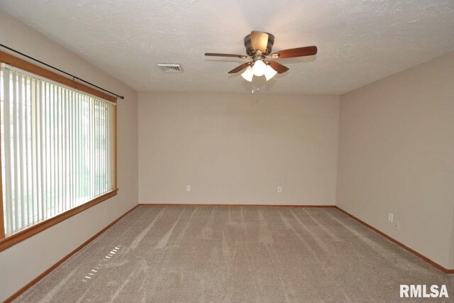 1409 Alton St, Pekin, IL 61554 - unfurnished room featuring a ceiling fan, light colored carpet, and a textured ceiling