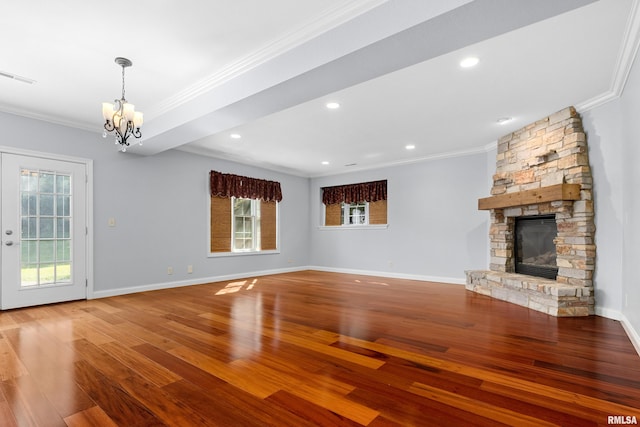 4851 Sheridan Rd, Groveland, IL 61535 - unfurnished living room with crown molding, a chandelier, hardwood / wood-style floors, a fireplace, and recessed lighting