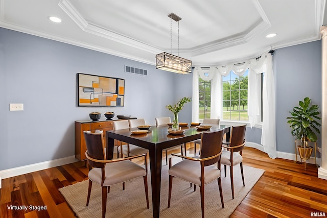 4851 Sheridan Rd, Groveland, IL 61535 - dining area featuring a tray ceiling, ornamental molding, recessed lighting, and light wood finished floors