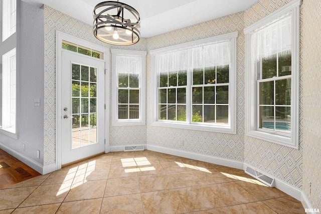 4851 Sheridan Rd, Groveland, IL 61535 - unfurnished sunroom with healthy amount of natural light and a chandelier