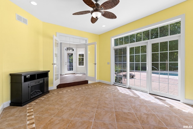 4851 Sheridan Rd, Groveland, IL 61535 - unfurnished living room with tile patterned flooring, ceiling fan, healthy amount of natural light, and recessed lighting