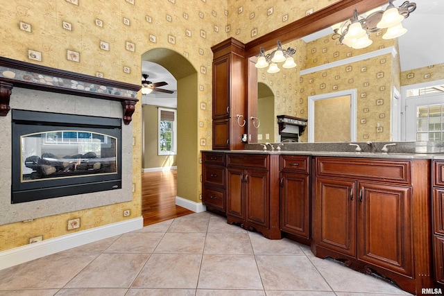 4851 Sheridan Rd, Groveland, IL 61535 - bathroom with double vanity, ceiling fan, tile patterned flooring, and wallpapered walls
