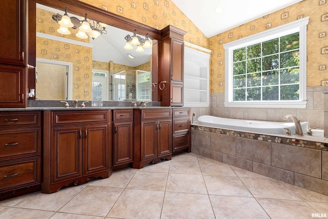 4851 Sheridan Rd, Groveland, IL 61535 - bathroom with vaulted ceiling, vanity, a bath, a stall shower, and tile patterned floors