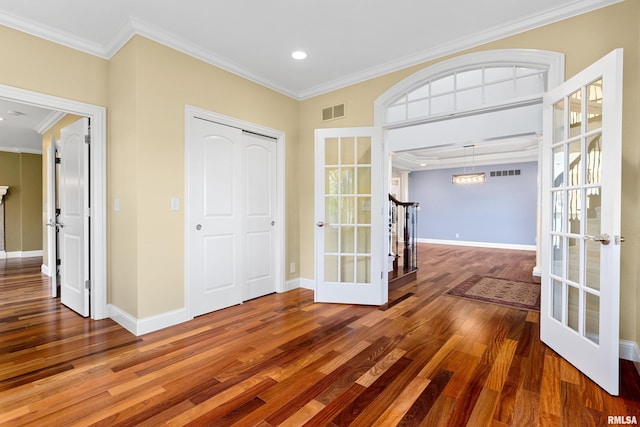 4851 Sheridan Rd, Groveland, IL 61535 - foyer entrance featuring french doors, wood finished floors, crown molding, and recessed lighting