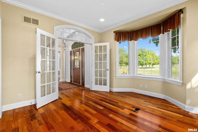 4851 Sheridan Rd, Groveland, IL 61535 - unfurnished room featuring french doors, ornamental molding, wood finished floors, and recessed lighting