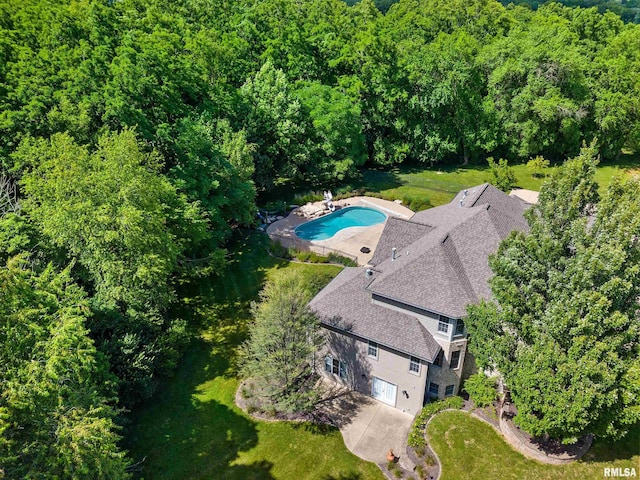 4851 Sheridan Rd, Groveland, IL 61535 - view from above of property featuring a pool area and a heavily wooded area