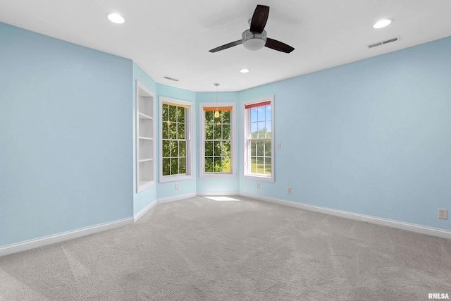 4851 Sheridan Rd, Groveland, IL 61535 - empty room with ceiling fan, carpet, recessed lighting, and built in features