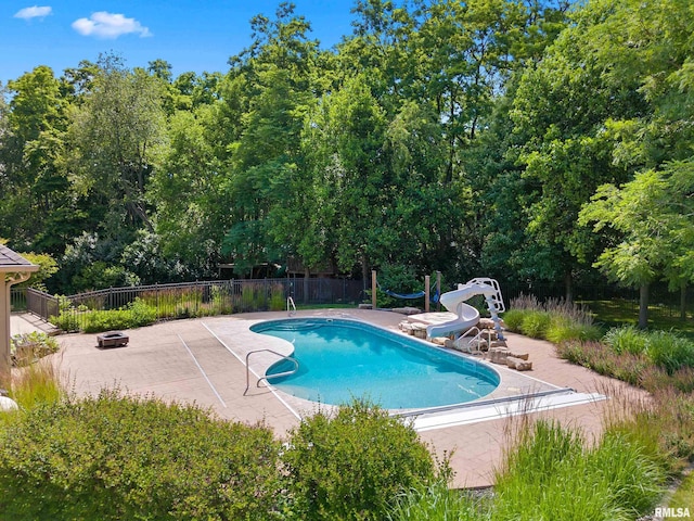 4851 Sheridan Rd, Groveland, IL 61535 - view of swimming pool featuring a water slide and a patio