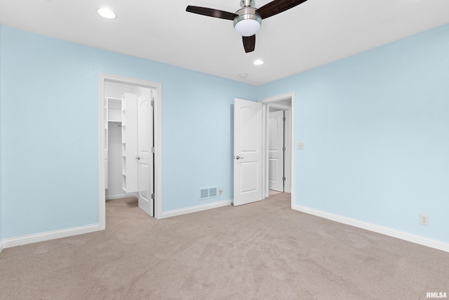 4851 Sheridan Rd, Groveland, IL 61535 - unfurnished bedroom with carpet flooring, a spacious closet, recessed lighting, ceiling fan, and a closet